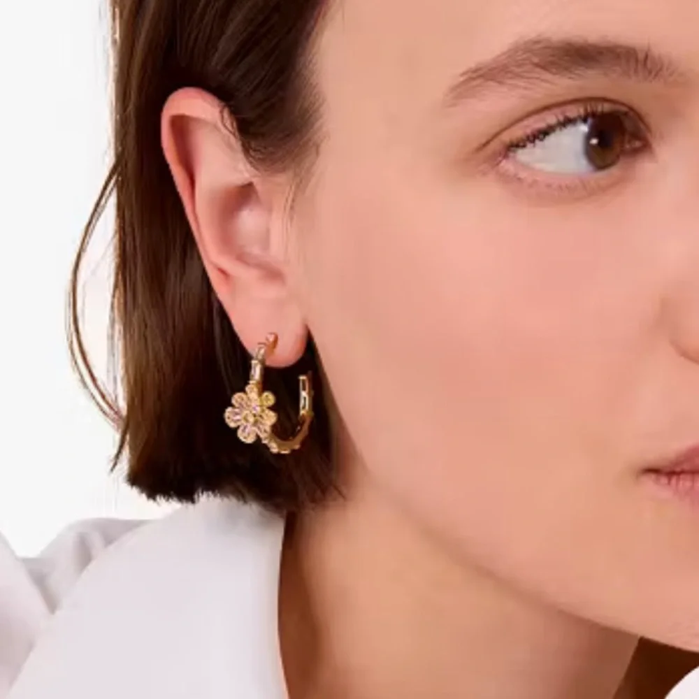 Kate Spade Fleurette Hoops in gold.